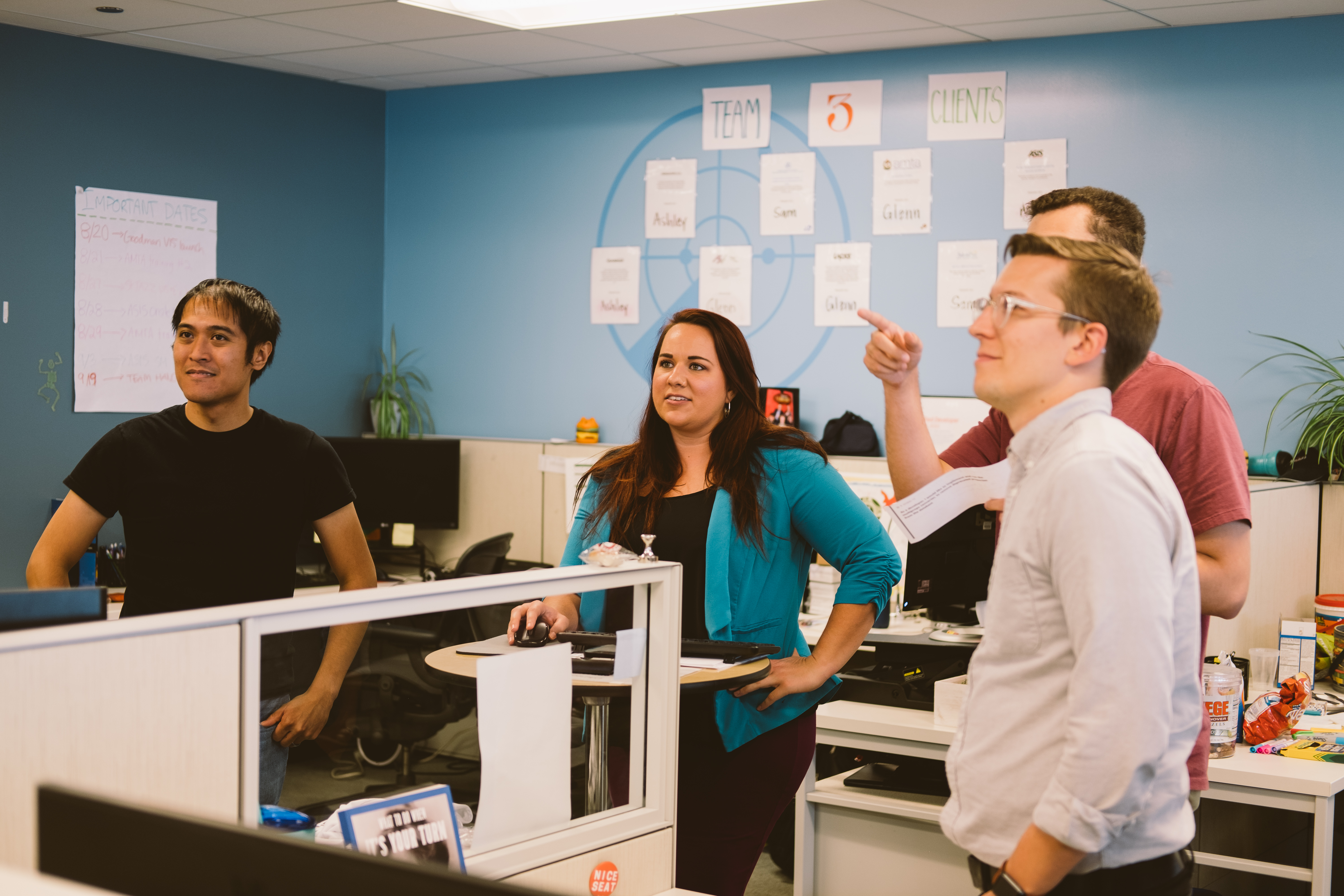 Workplace team discussing different digital initiatives across departments, reflecting fragmented AI adoption